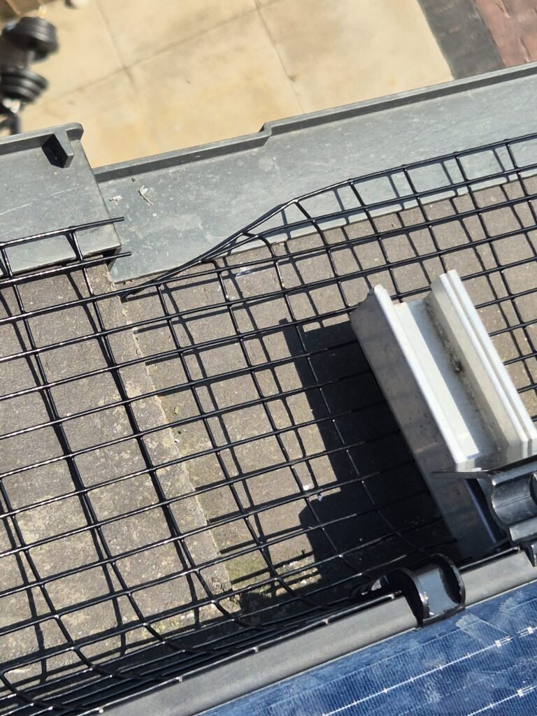 Close-up of solar panel pigeon proofing mesh installed on residential solar panels.