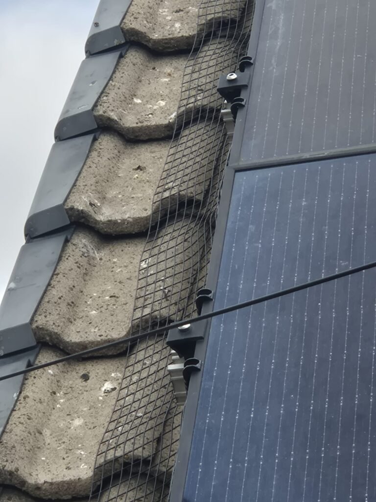Finished solar pigeon proofing installation on a property in Leeds with secure pigeon guarding fitted around the solar panels.