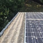 Side view of solar panel pigeon proofing mesh installation