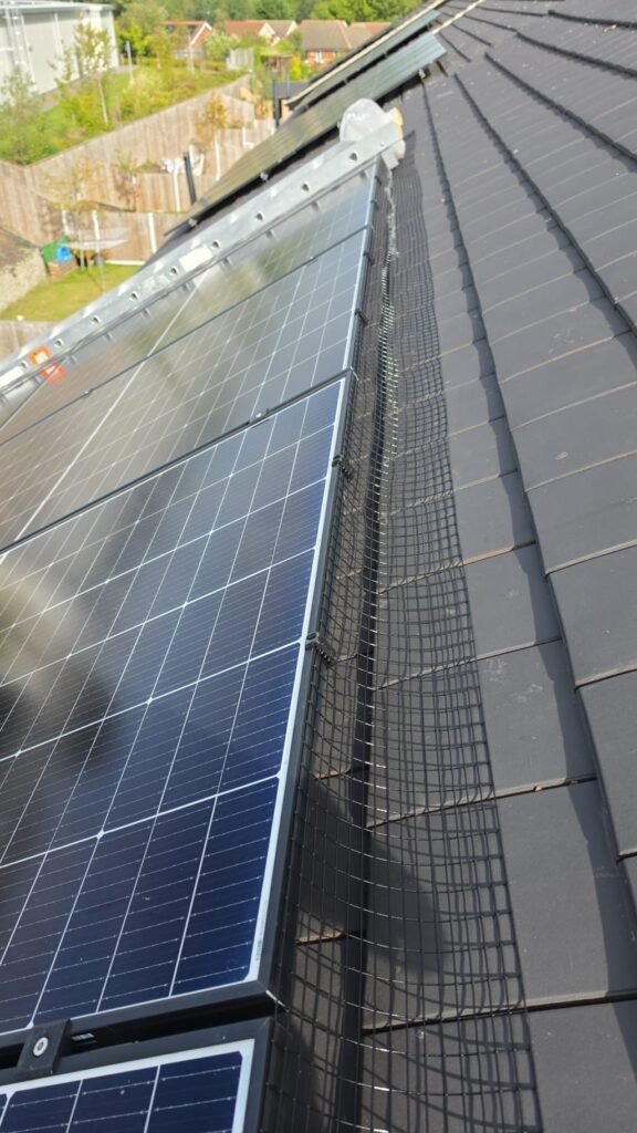 Solar panels in Chapeltown Sheffield fitted with black PVC-coated solar pigeon-proofing mesh using 35mm UV-rated Solar Fast Fix clips.